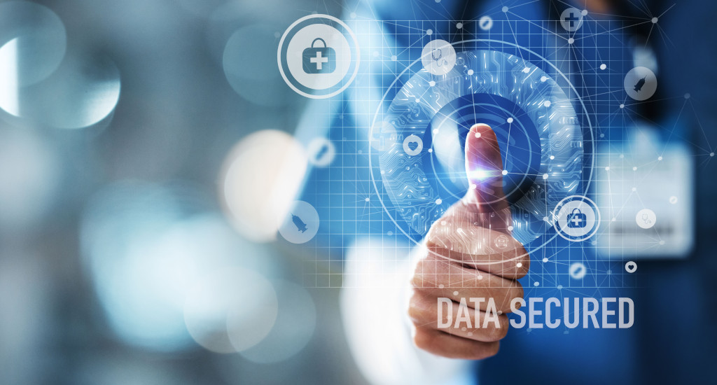 A virtual sreen with a person pressing where it says Data Secured